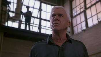 Movie still from “Naked Gun 33 1/3: The Final Insult” (1994), directed by Peter Segal – An older man looking up into the sky; Close Up shot, Low angle