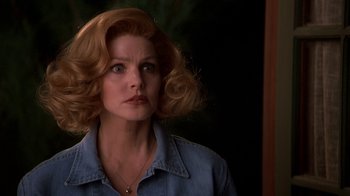 Movie still from “Naked Gun 33 1/3: The Final Insult” (1994), directed by Peter Segal – A person wearing a blue shirt; Close Up shot, Over the shoulder angle