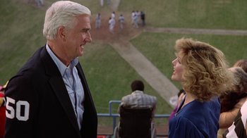 Movie still from “The Naked Gun: From the Files of Police Squad!” (1988), directed by David Zucker – A man and a woman talking to each other; Medium shot, Over the shoulder angle