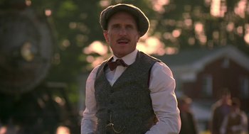 Movie still from “The Natural” (1984), directed by Barry Levinson – A man wearing a hat and a vest; Close Up shot, Low angle