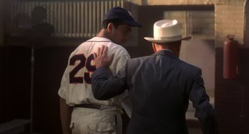 Movie still from “The Natural” (1984), directed by Barry Levinson – A baseball player and an older man are talking; Medium shot, Over the shoulder angle