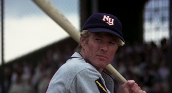 Movie still from “The Natural” (1984), directed by Barry Levinson – A baseball player holding a baseball bat; Close Up shot, Low angle