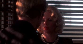 Movie still from “The Natural” (1984), directed by Barry Levinson – A man and a woman are looking at one another; Close Up shot, Over the shoulder angle