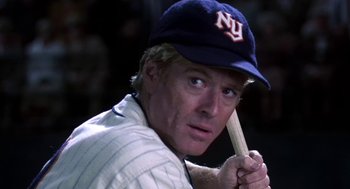 Movie still from “The Natural” (1984), directed by Barry Levinson – A baseball player holding a baseball bat; Close Up shot, Over the shoulder angle
