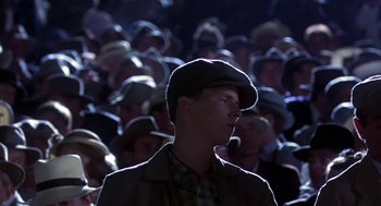 Movie still from “The Natural” (1984), directed by Barry Levinson – A crowd of people wearing hats and a jacket; Close Up shot, Low angle