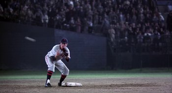 Movie still from “The Natural” (1984), directed by Barry Levinson – A baseball player in the middle of a game; Wide shot, High angle