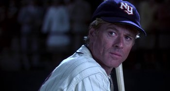 Movie still from “The Natural” (1984), directed by Barry Levinson – A baseball player holding a baseball bat; Close Up shot, Over the shoulder angle
