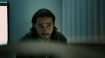 Movie still from “Charlie Countryman” (2013), directed by Fredrik Bond – A person sitting in front of a computer; Close Up shot, Over the shoulder angle