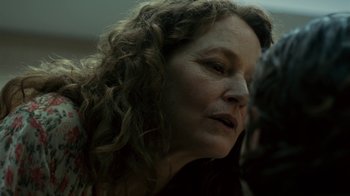 Movie still from “Charlie Countryman” (2013), directed by Fredrik Bond – A person with curly hair; Close Up shot, Over the shoulder angle