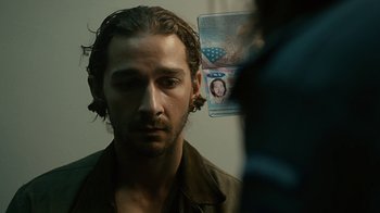 Movie still from “Charlie Countryman” (2013), directed by Fredrik Bond – A person with a passport; Close Up shot, Over the shoulder angle