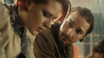 Movie still from “Charlie Countryman” (2013), directed by Fredrik Bond – A man and a woman looking at one another; Close Up shot, Over the shoulder angle