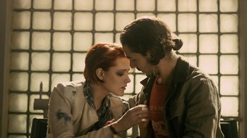Movie still from “Charlie Countryman” (2013), directed by Fredrik Bond – A man and a woman looking at each other; Medium shot, Low angle
