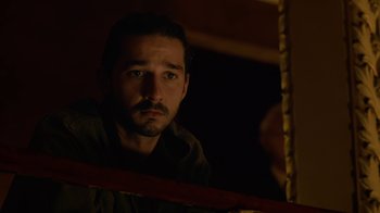 Movie still from “Charlie Countryman” (2013), directed by Fredrik Bond – A man looking at himself in a mirror; Close Up shot, Low angle