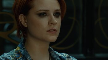 Movie still from “Charlie Countryman” (2013), directed by Fredrik Bond – A person with short red hair; Close Up shot, Over the shoulder angle