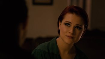 Movie still from “Charlie Countryman” (2013), directed by Fredrik Bond – A person sitting in a room; Close Up shot, Over the shoulder angle