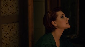 Movie still from “Charlie Countryman” (2013), directed by Fredrik Bond – A person with her eyes closed; Close Up shot, Over the shoulder angle