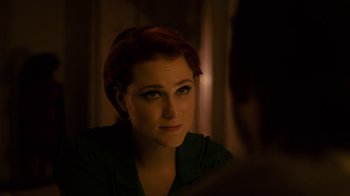 Movie still from “Charlie Countryman” (2013), directed by Fredrik Bond – A person looking at a mirror; Close Up shot, Over the shoulder angle