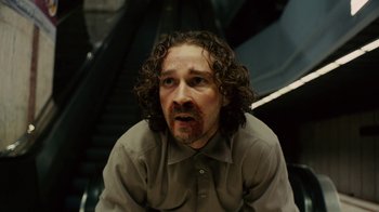 Movie still from “Charlie Countryman” (2013), directed by Fredrik Bond – A person with long curly hair; Close Up shot, Low angle