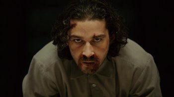 Movie still from “Charlie Countryman” (2013), directed by Fredrik Bond – A person with blood on his face; Close Up shot, High angle