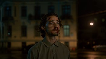 Movie still from “Charlie Countryman” (2013), directed by Fredrik Bond – A man with blood all over his face; Close Up shot, Low angle