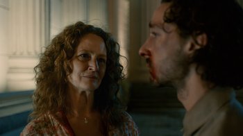 Movie still from “Charlie Countryman” (2013), directed by Fredrik Bond – A man and a woman are talking to each other; Close Up shot, Over the shoulder angle