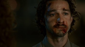 Movie still from “Charlie Countryman” (2013), directed by Fredrik Bond – A person with blood all over his face; Close Up shot, Low angle