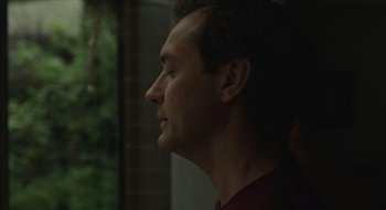 Movie still from “The Nest” (2020), directed by Sean Durkin – A person with his eyes closed; Close Up shot, Low angle