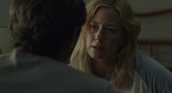 Movie still from “The Nest” (2020), directed by Sean Durkin – A woman looking at a man in front of a mirror; Close Up shot, Over the shoulder angle