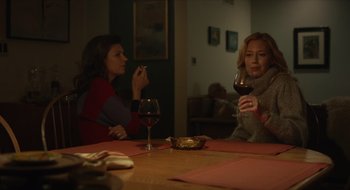 Movie still from “The Nest” (2020), directed by Sean Durkin – Two women sitting at a table drinking wine; Medium shot, Over the shoulder angle