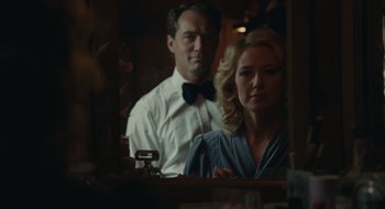 Movie still from “The Nest” (2020), directed by Sean Durkin – A man and a woman in front of a mirror; Medium shot, Over the shoulder angle