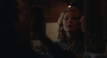 Movie still from “The Nest” (2020), directed by Sean Durkin – A woman sitting in front of a mirror holding a makeup brush; Close Up shot, Over the shoulder angle