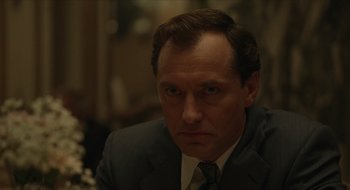 Movie still from “The Nest” (2020), directed by Sean Durkin – A man in a suit and tie; Close Up shot, Over the shoulder angle