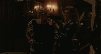 Movie still from “The Nest” (2020), directed by Sean Durkin – Two women are standing in front of each other; Medium shot, Over the shoulder angle
