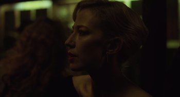 Movie still from “The Nest” (2020), directed by Sean Durkin – A beautiful woman with long blonde hair wearing ear rings; Close Up shot, Over the shoulder angle