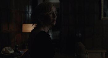Movie still from “The Nest” (2020), directed by Sean Durkin – A woman in a dark room looking into the distance; Close Up shot, Over the shoulder angle
