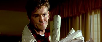 Movie still from “The NeverEnding Story II: The Next Chapter” (1990), directed by George Miller – A person wearing a red and white plaid shirt; Close Up shot, Low angle