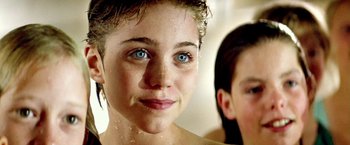 Movie still from “The NeverEnding Story II: The Next Chapter” (1990), directed by George Miller – A person with blue eyes; Close Up shot, Over the shoulder angle