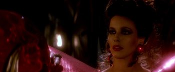 Movie still from “The NeverEnding Story II: The Next Chapter” (1990), directed by George Miller – A person wearing a dress; Close Up shot, Over the shoulder angle