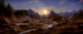 Movie still from “The NeverEnding Story II: The Next Chapter” (1990), directed by George Miller – An airplane flying over a mountain range at sunset; Extreme Wide shot, High angle