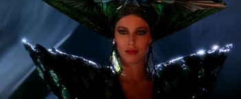 Movie still from “The NeverEnding Story II: The Next Chapter” (1990), directed by George Miller – A person wearing a hat and holding an umbrella; Close Up shot, Low angle