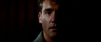 Movie still from “The NeverEnding Story II: The Next Chapter” (1990), directed by George Miller – A man's face in the dark; Close Up shot, Low angle