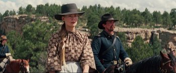 Movie still from “Hostiles” (2017), directed by Scott Cooper – A man and a woman dressed in civil war clothing; Medium shot, Low angle