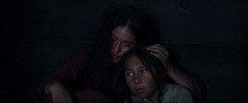 Movie still from “Hostiles” (2017), directed by Scott Cooper – A woman and a young girl are looking at the camera; Close Up shot, High angle