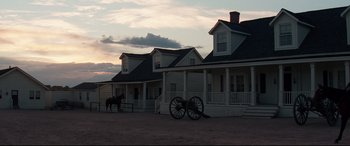Movie still from “Hostiles” (2017), directed by Scott Cooper – A horse and buggy in front of a house; Extreme Wide shot, Low angle