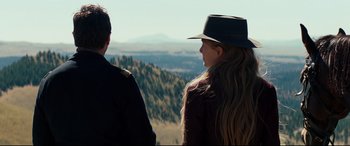 Movie still from “Hostiles” (2017), directed by Scott Cooper – A man and a woman looking out over a valley; Medium shot, Over the shoulder angle
