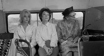 Movie still from “The Night of the Iguana” (1964), directed by John Huston – A group of women sitting on top of a bus; Medium shot, Over the shoulder angle