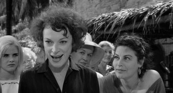 Movie still from “The Night of the Iguana” (1964), directed by John Huston – A black and white photo of two women and a man; Close Up shot, Over the shoulder angle