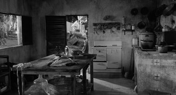 Movie still from “The Night of the Iguana” (1964), directed by John Huston – An old fashioned kitchen with an old fashioned stove; Wide shot, High angle