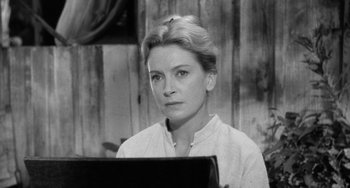 Movie still from “The Night of the Iguana” (1964), directed by John Huston – Black and white photograph of a woman looking at the camera; Close Up shot, Low angle