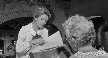 Movie still from “The Night of the Iguana” (1964), directed by John Huston – Two women are looking at a piece of paper; Medium shot, Over the shoulder angle